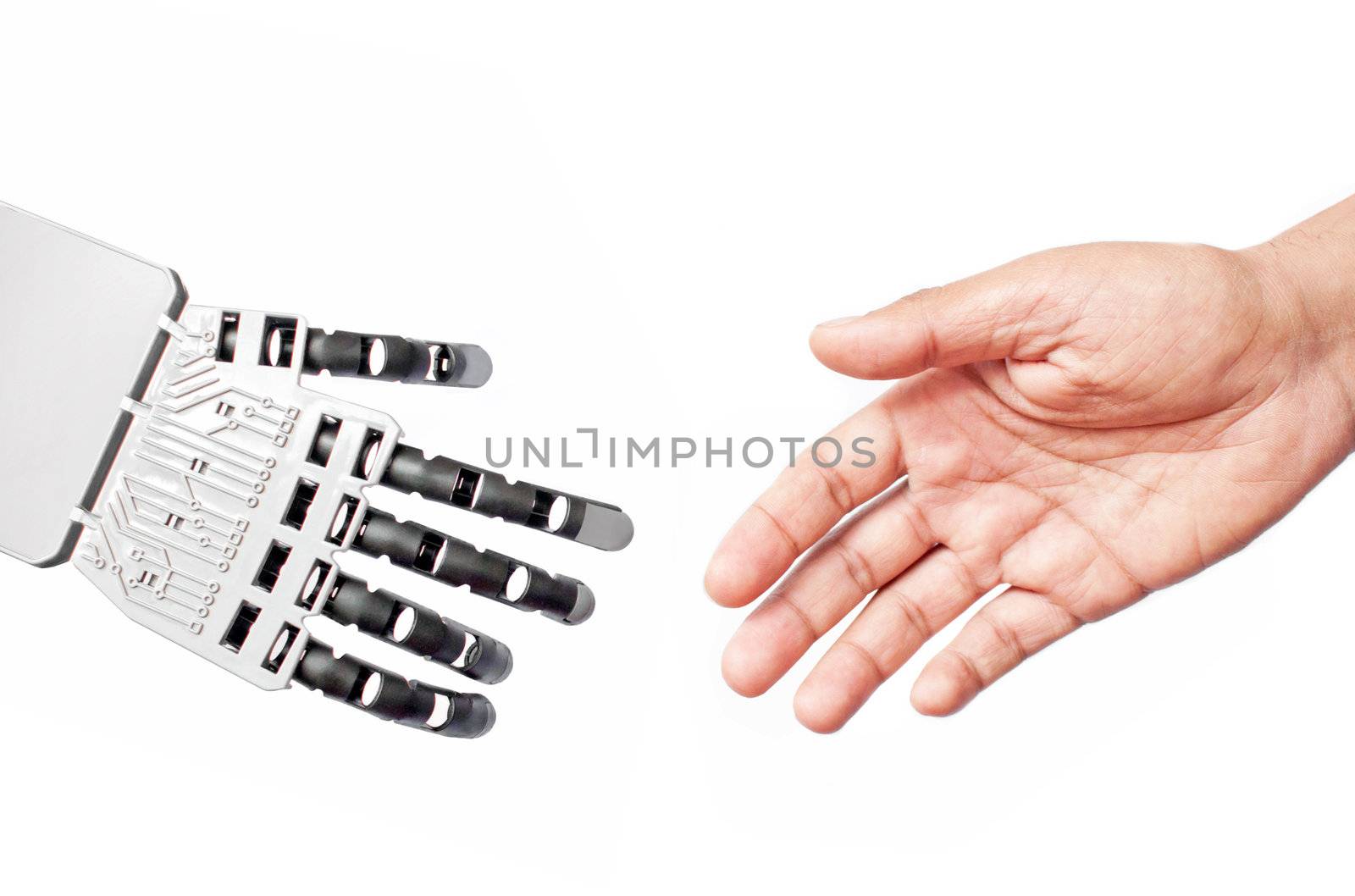 Robot hand and man coming together to shake hands 