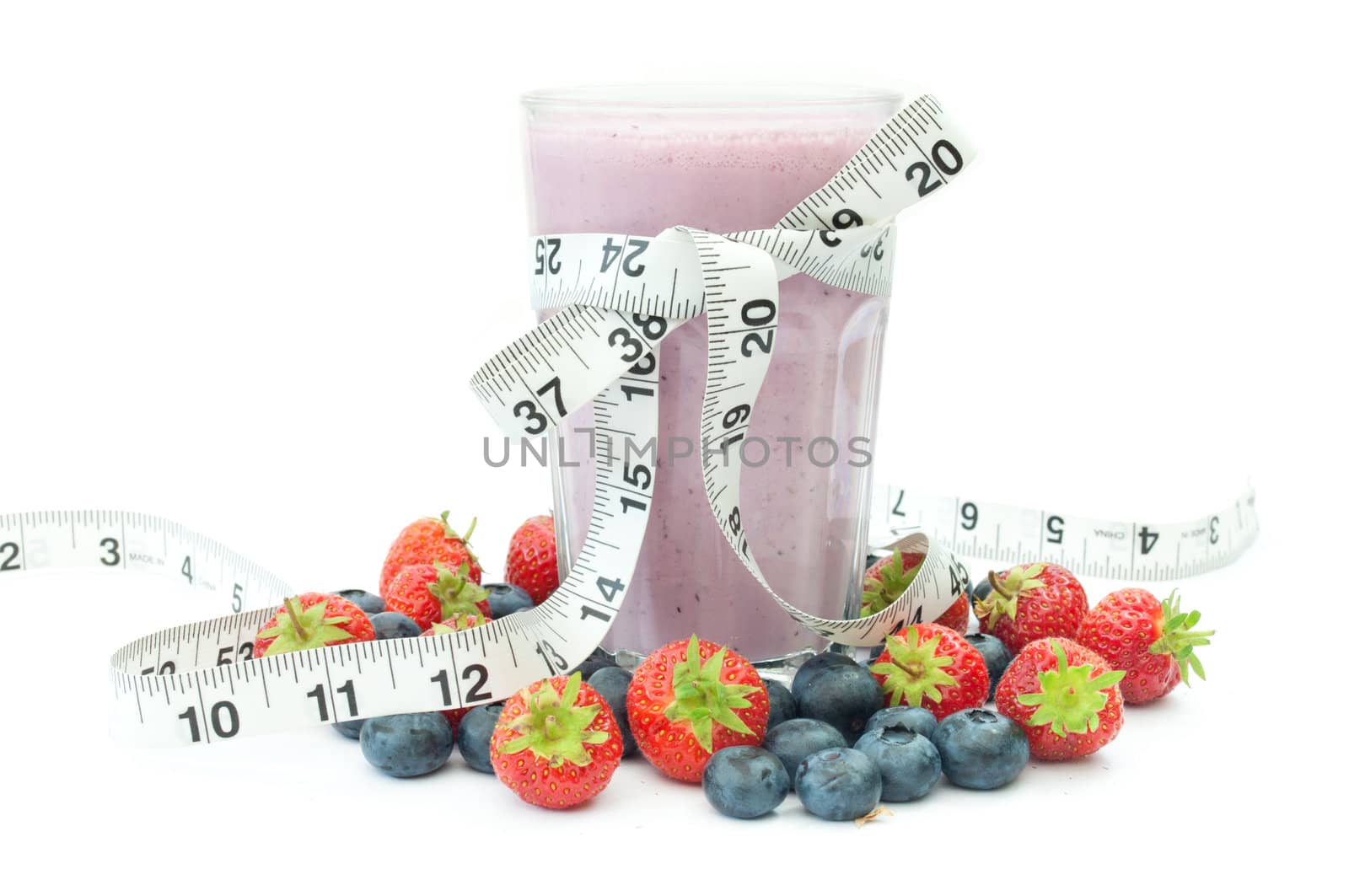 Tape measure around a berry flavored smoothie 