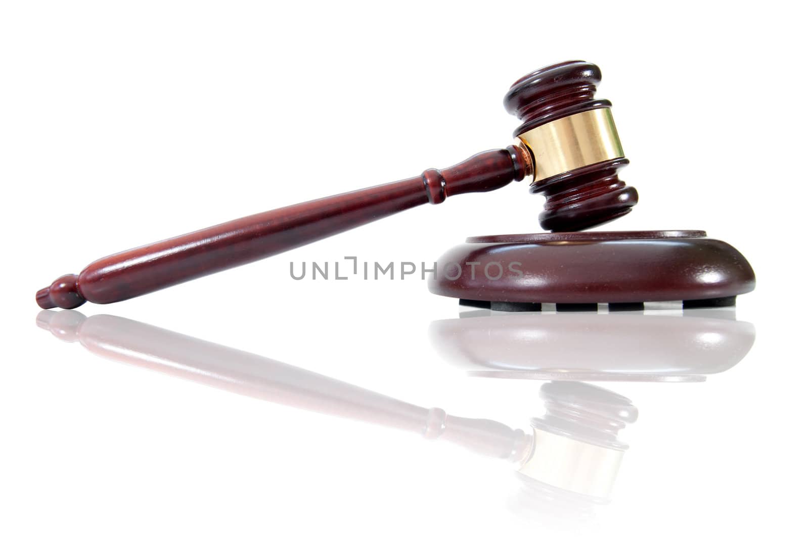 Gavel with reflection against a white background