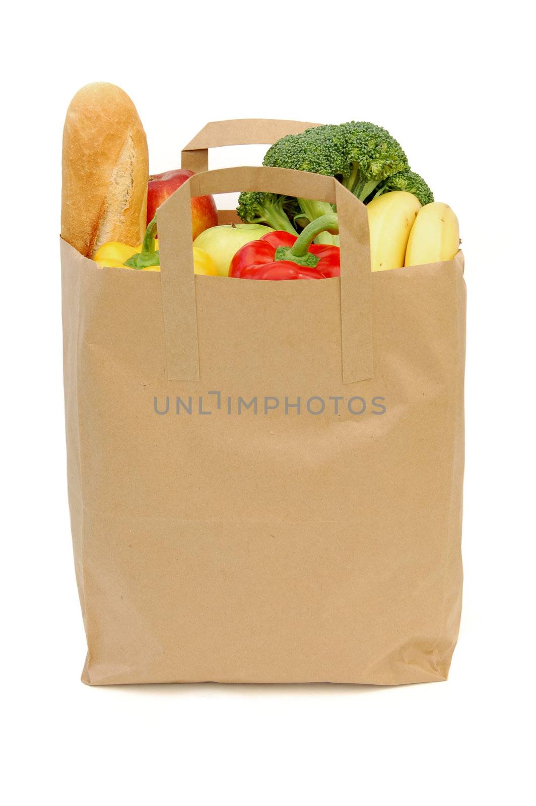 Brown bag with fruit, vegetables and a french loaf