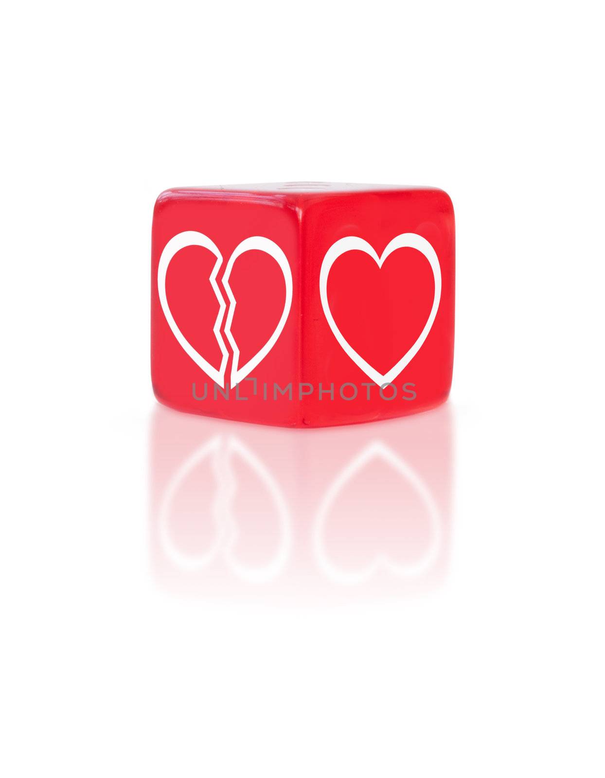Dice with two symbols representing the risk between love and a broken heart