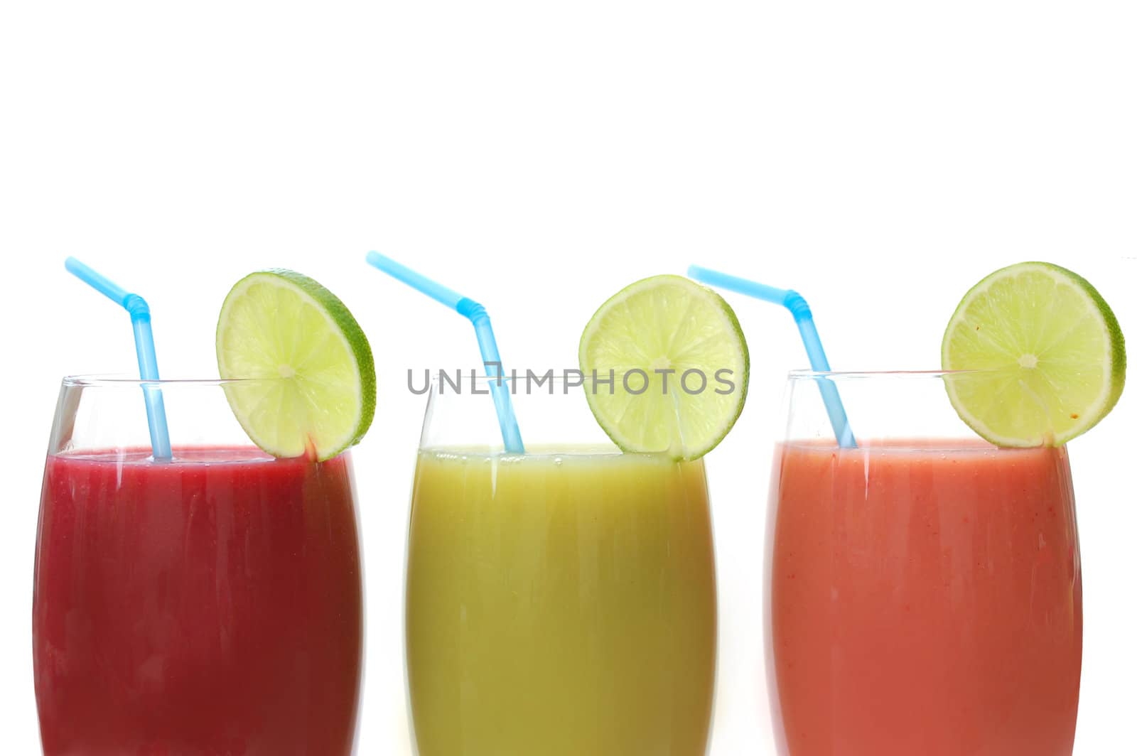 Selection of different juices with a slice of lime