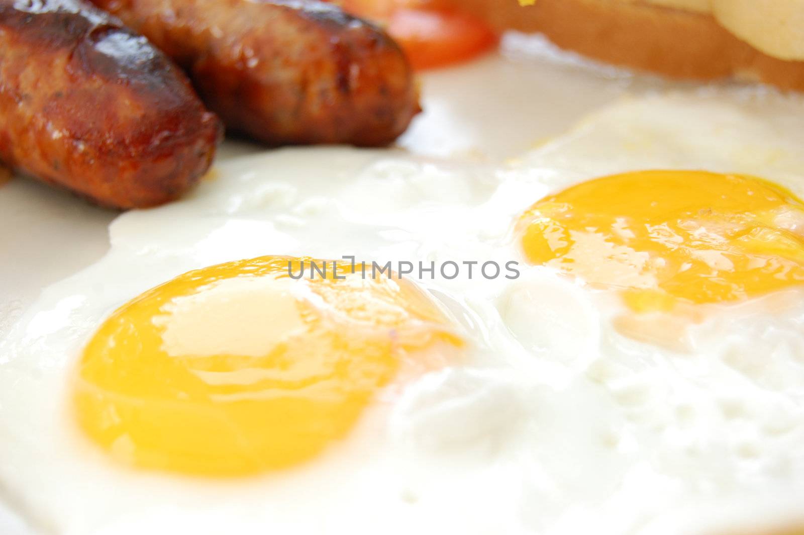Tasty sausages and eggs by unikpix