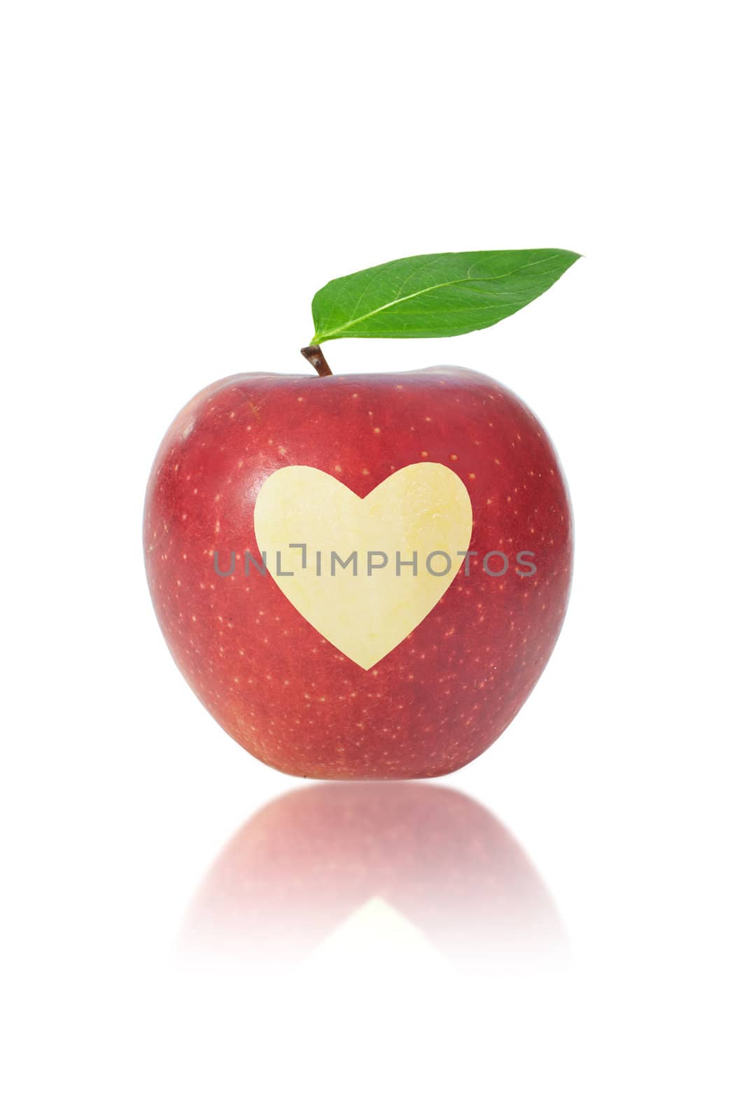 Red apple with a heart shape carved in the middle 