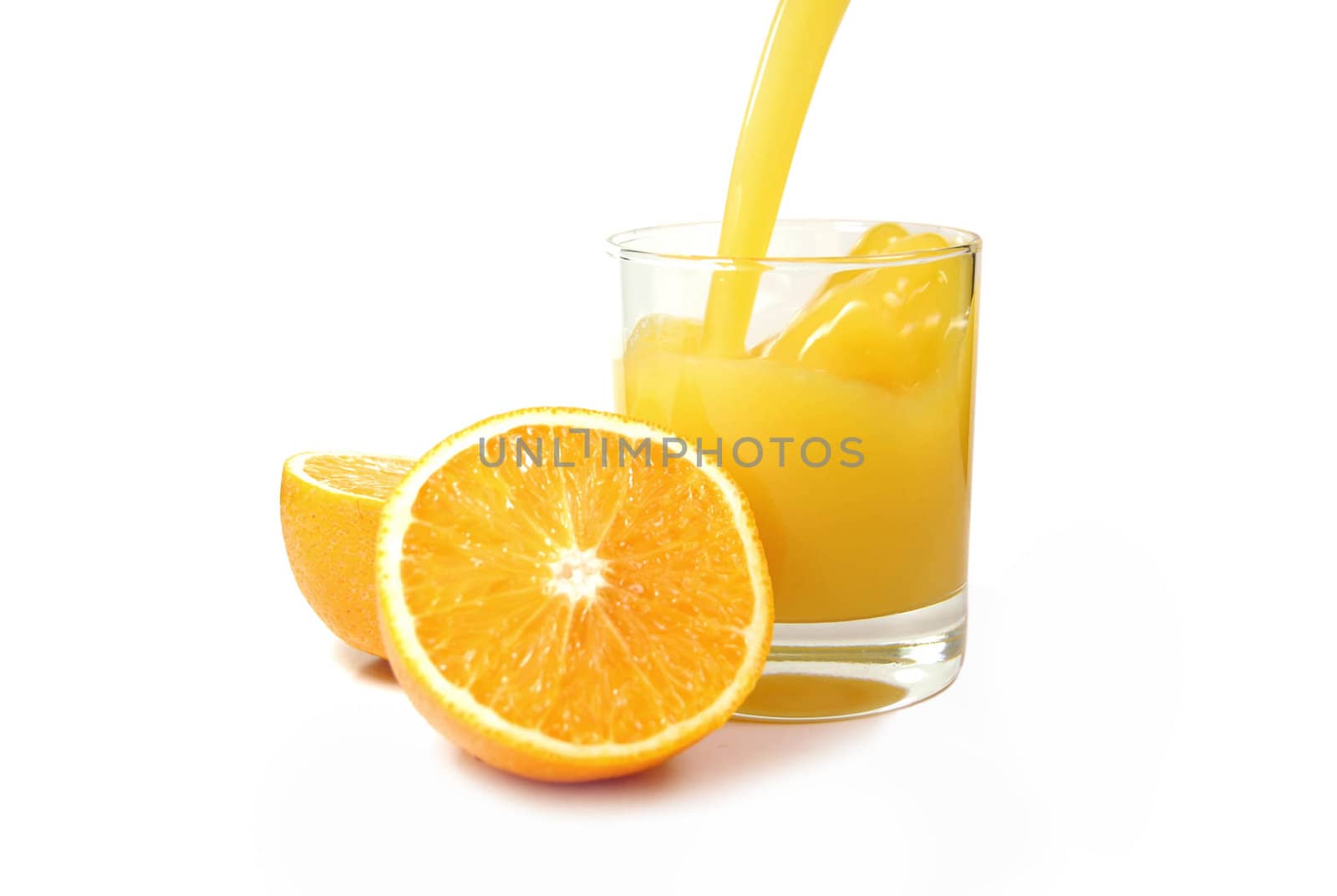 Pouring a fresh glass of orange juice