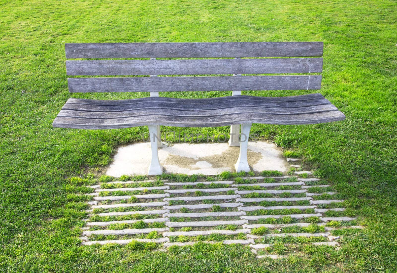 Portugal. Lisbon. Bench in a lawn  