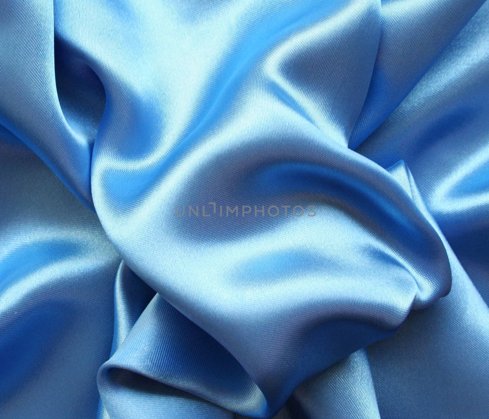 Smooth elegant blue silk as background by oxanatravel