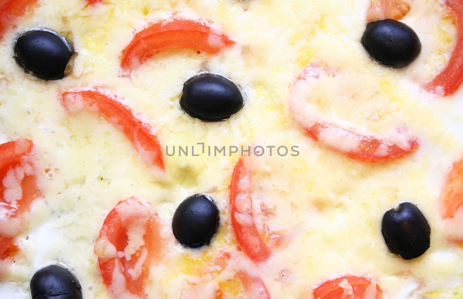 Omelette with tomatoes, black olive and cheese