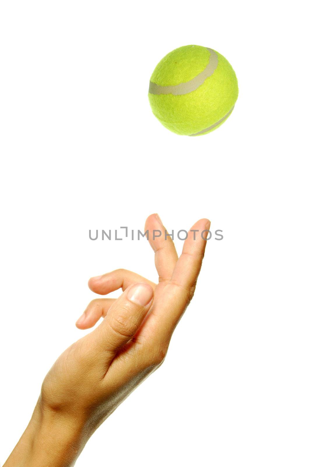 Closeup of a ball being tossed in the air to serve