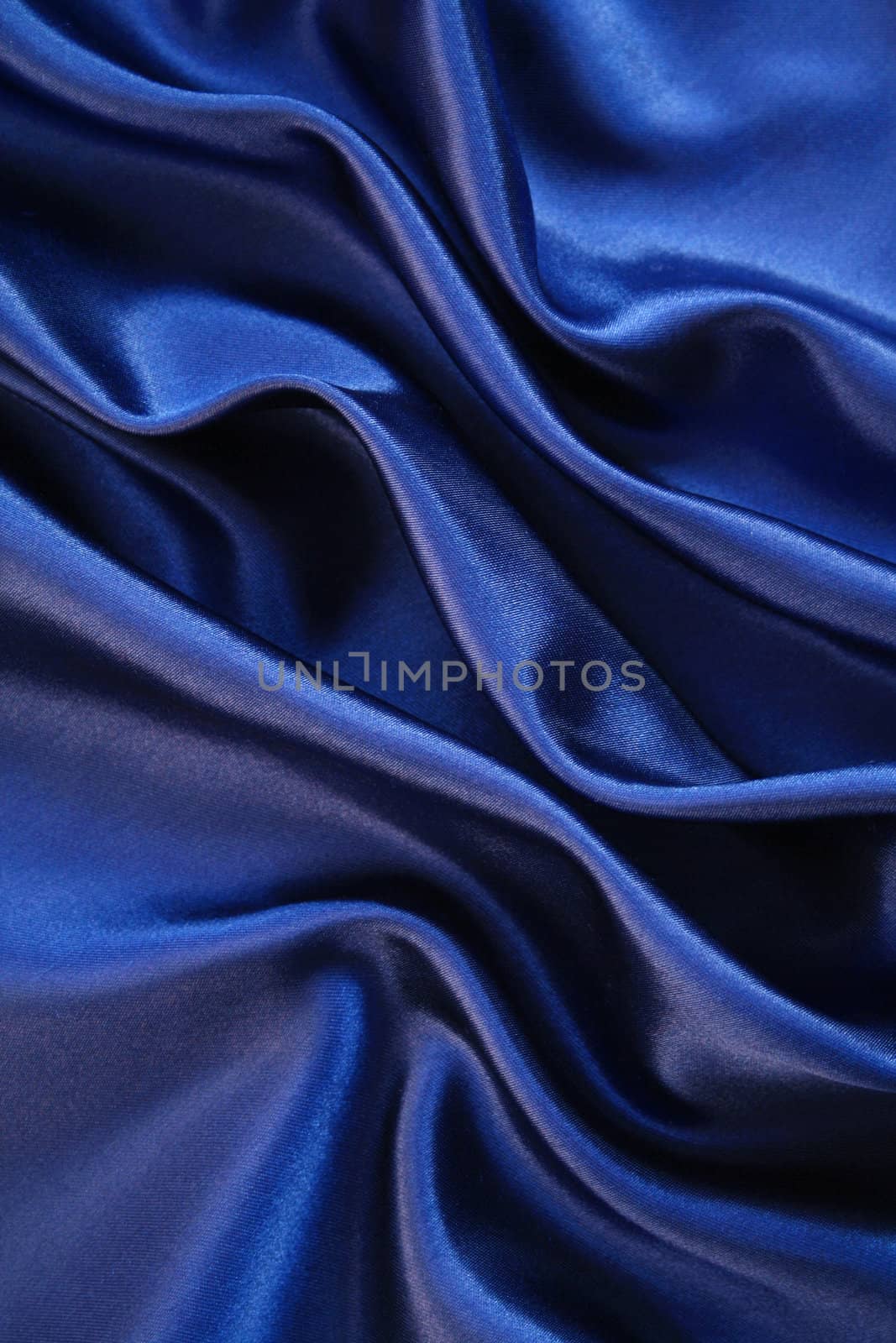 Smooth elegant dark blue silk can use as background 