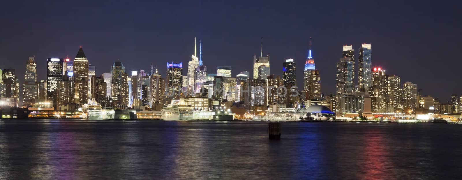 The New York City Uptown w Intrepid sea, air and space museum in the night