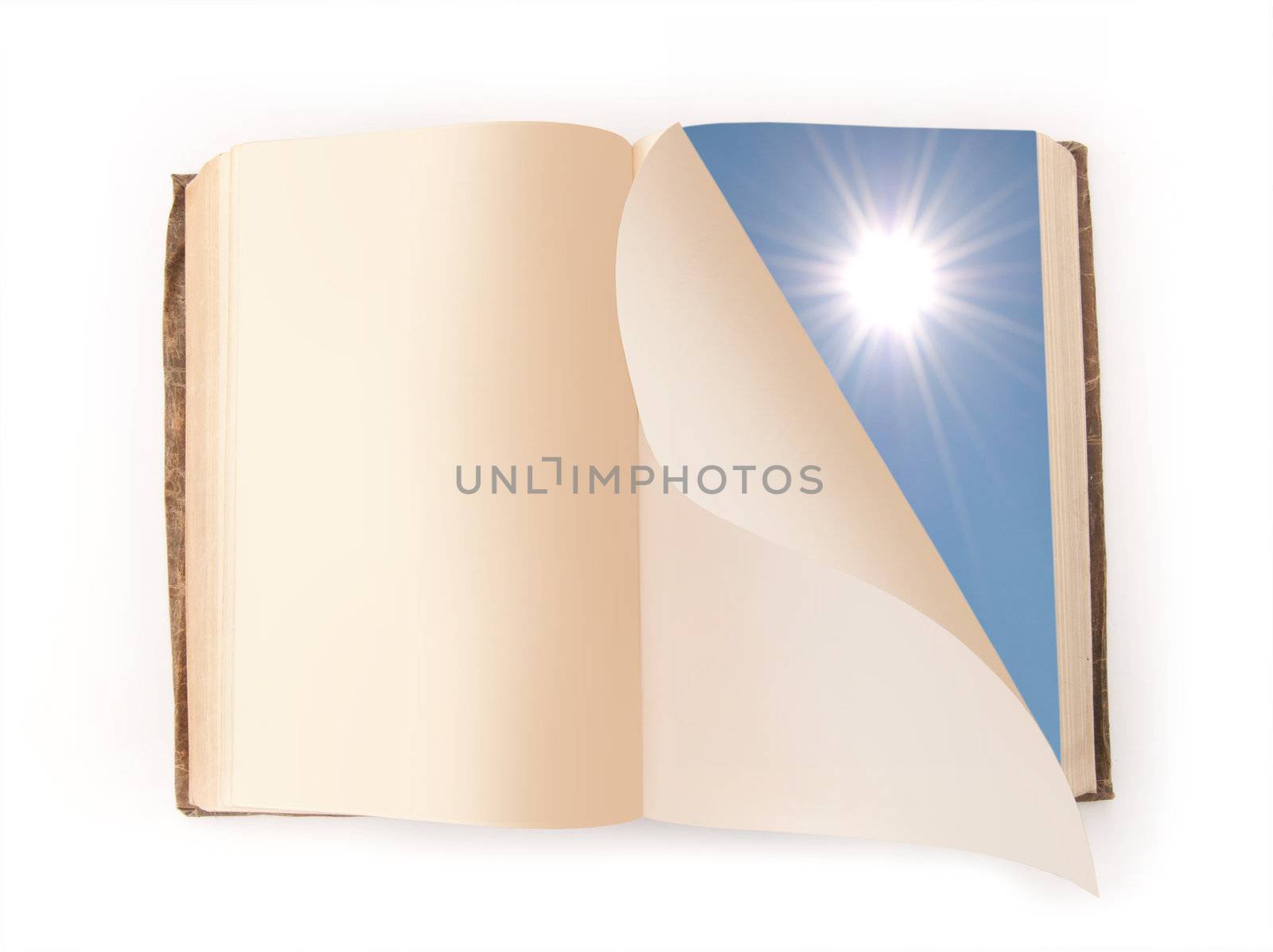 Page of a book turning with the image of blue sky and sun on one side 