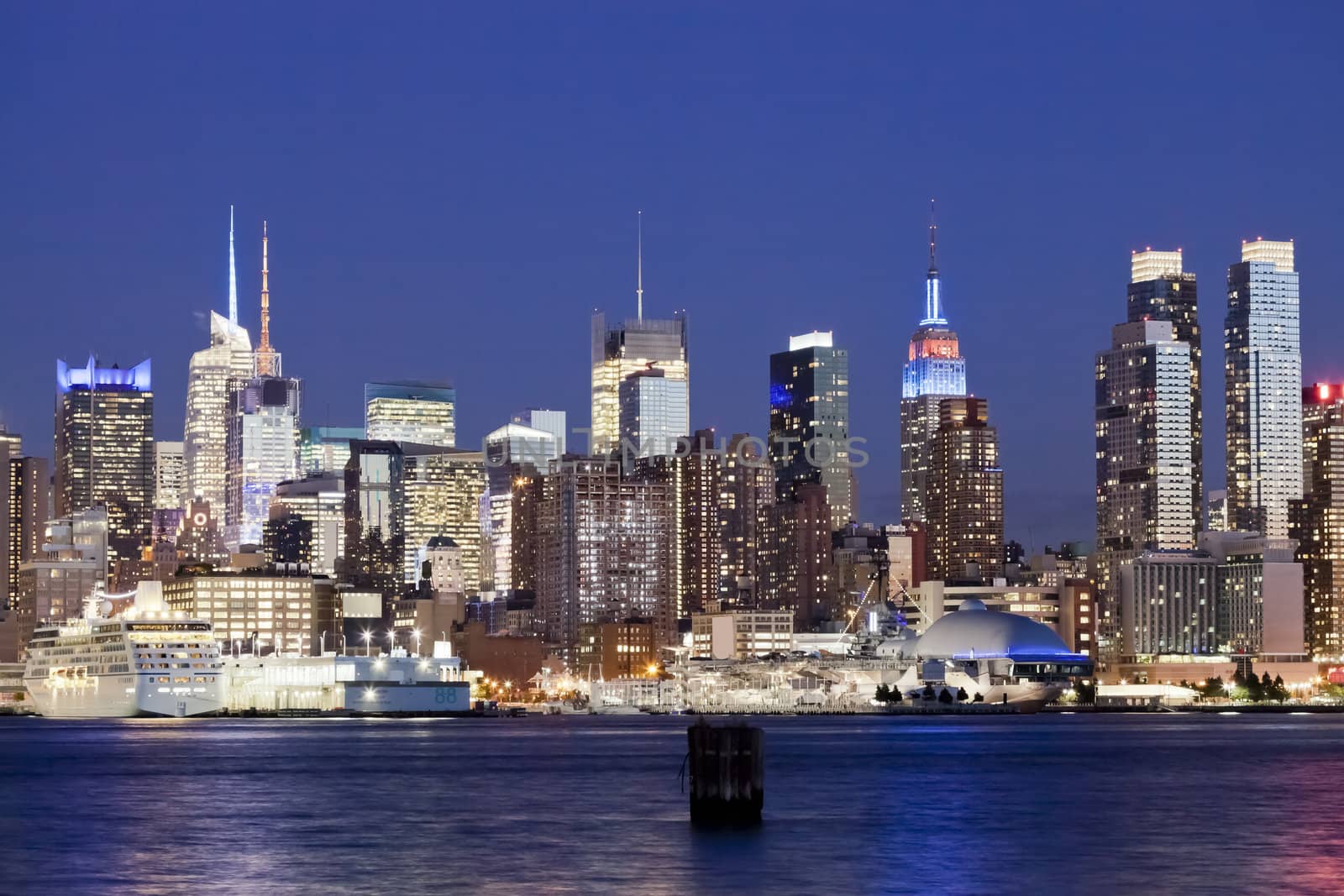 The New York City Uptown w Intrepid sea, air and space museum in the night