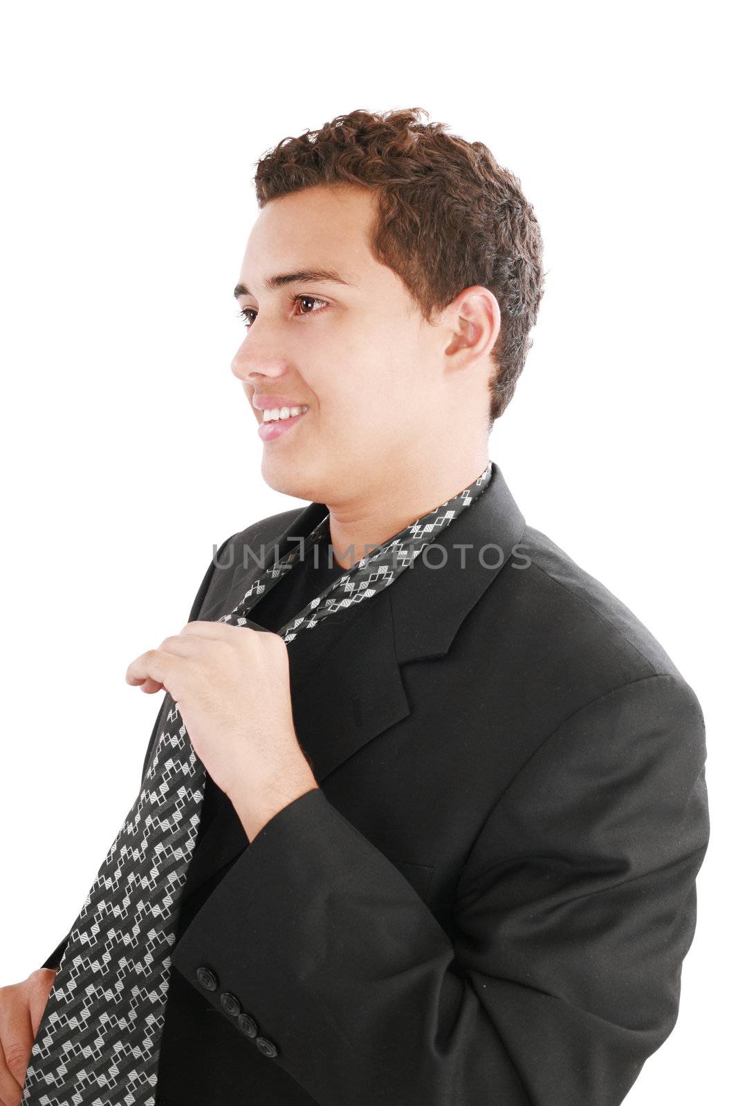 An young man fixing his tie