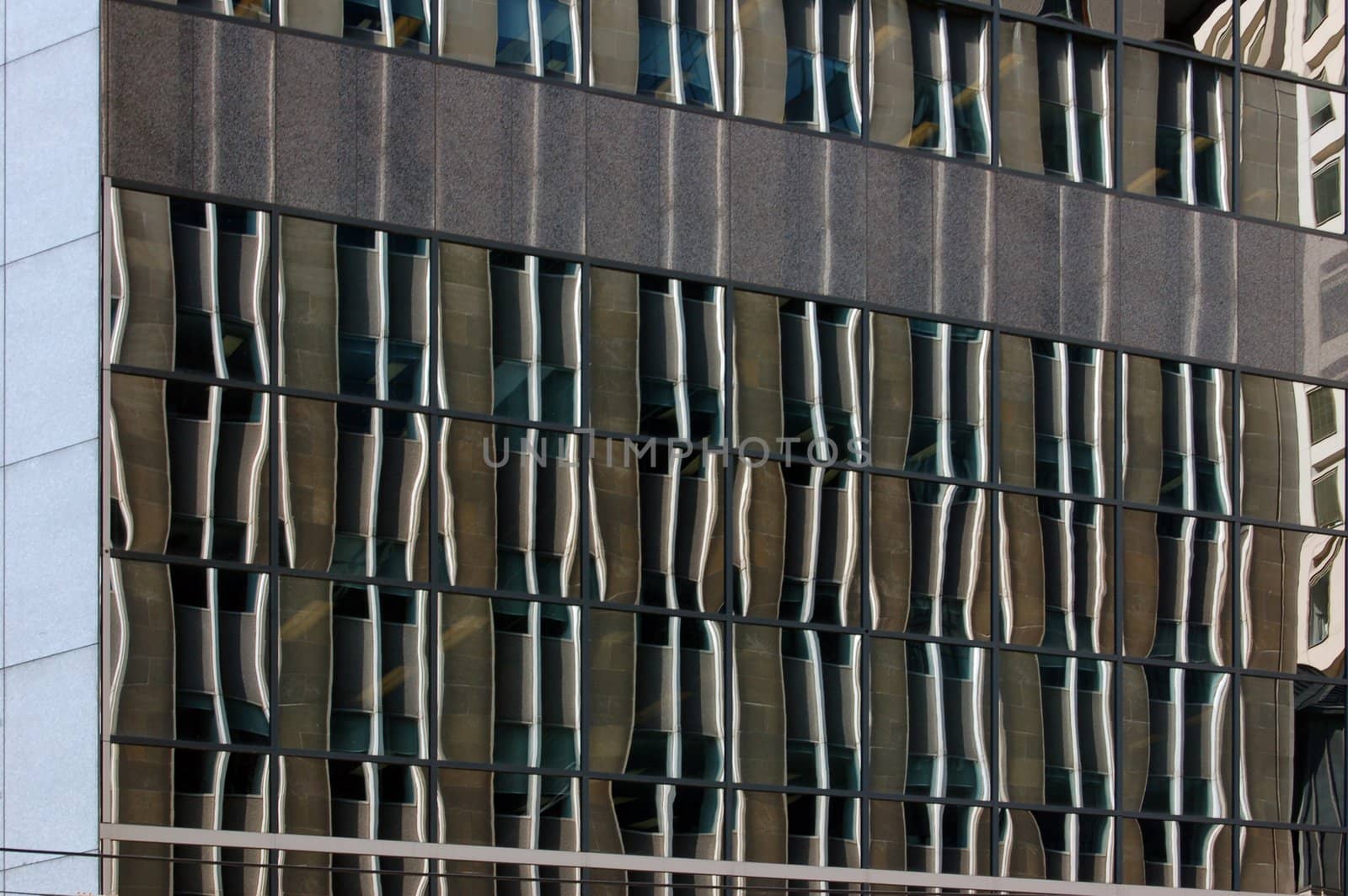 reflection in a glass wall of a high-rise building