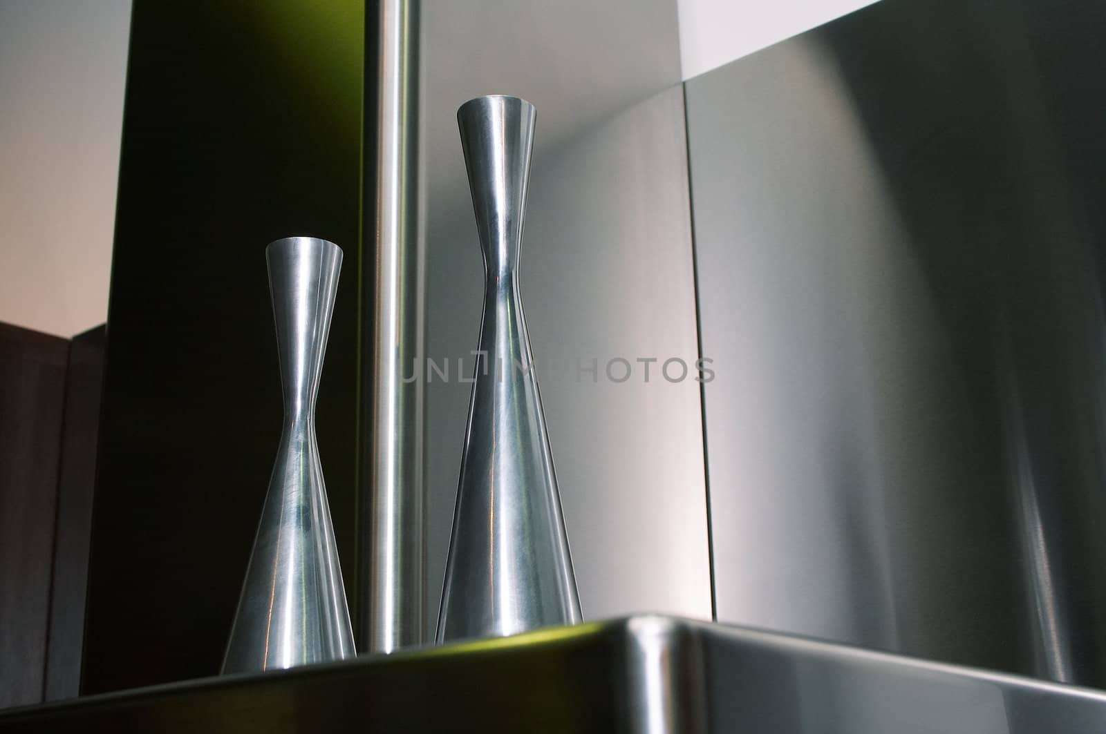 Metal flower vases on a metal background