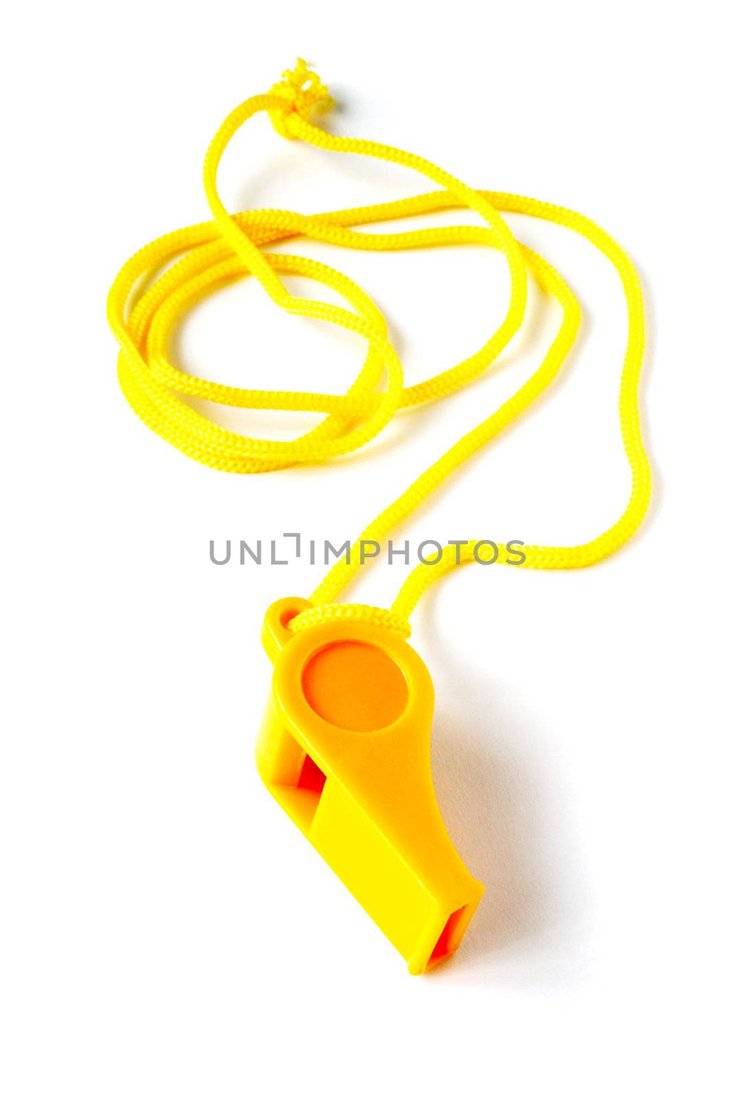 Yellow football whistle on a white background