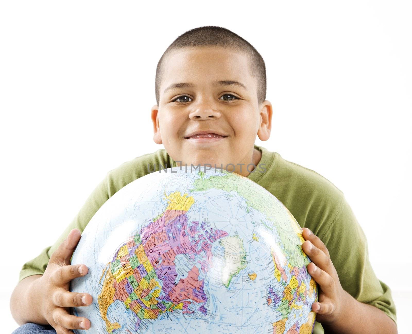Smiling young hispanic boy with globe by iofoto