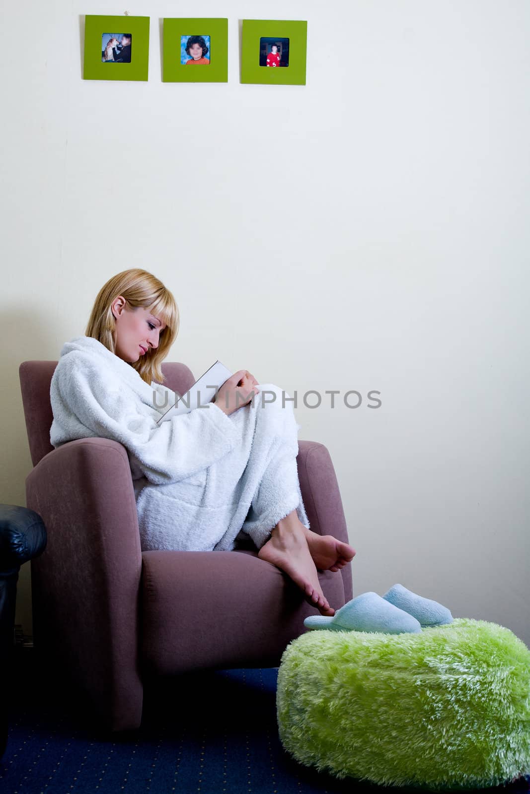Relaxed blond model  is reading a book