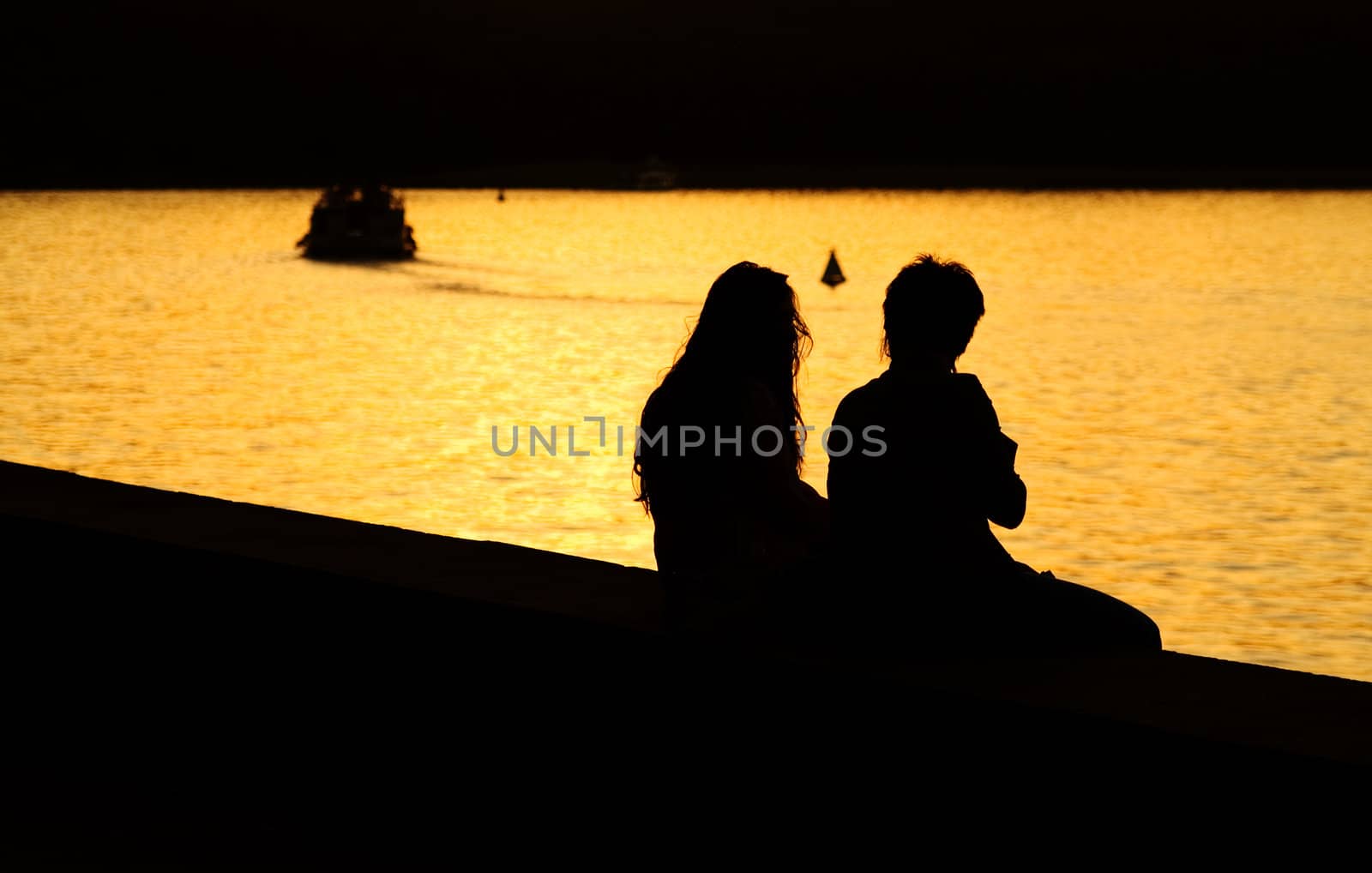 Silhouette of Young Couple at Sunset