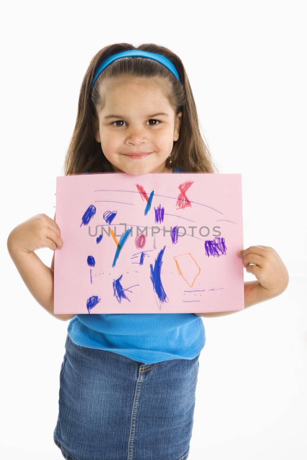 Smiling hispanic girl proudly holding drawing.