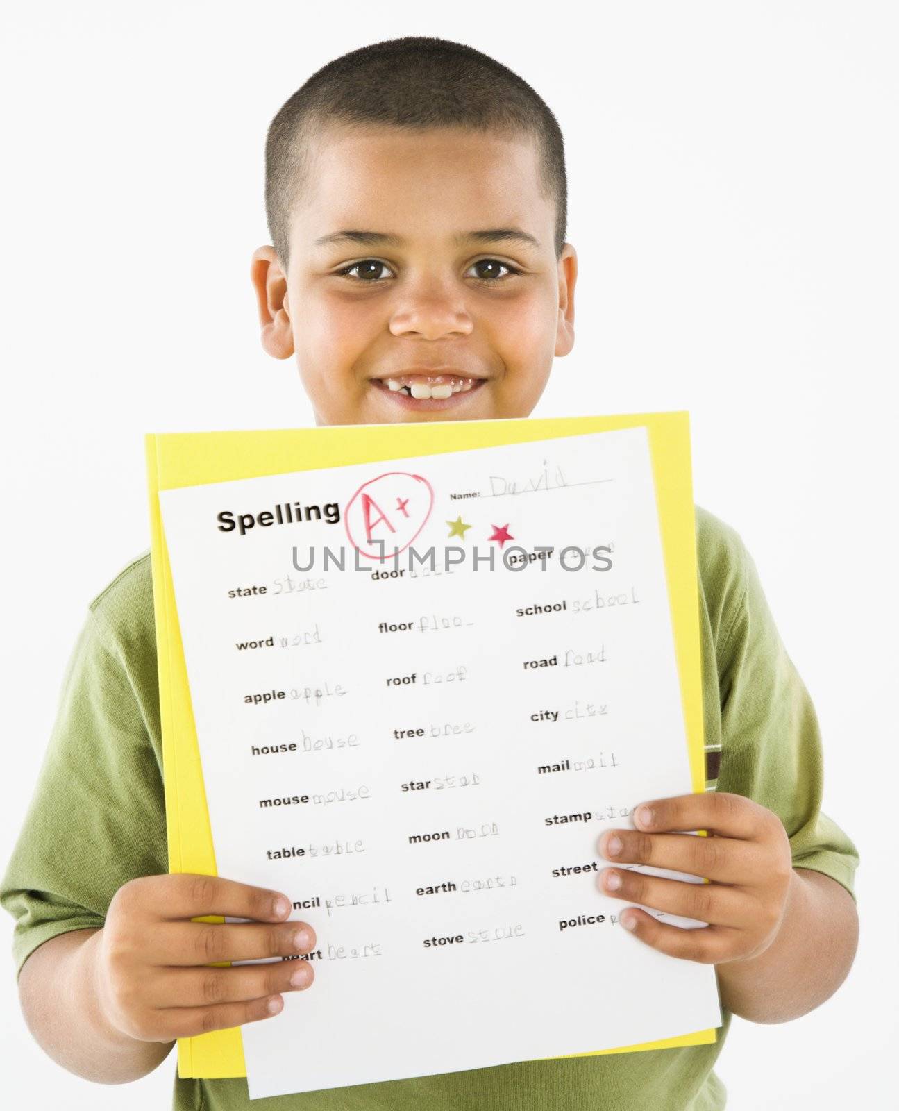 Smiling hispanic boy holding homework. by iofoto