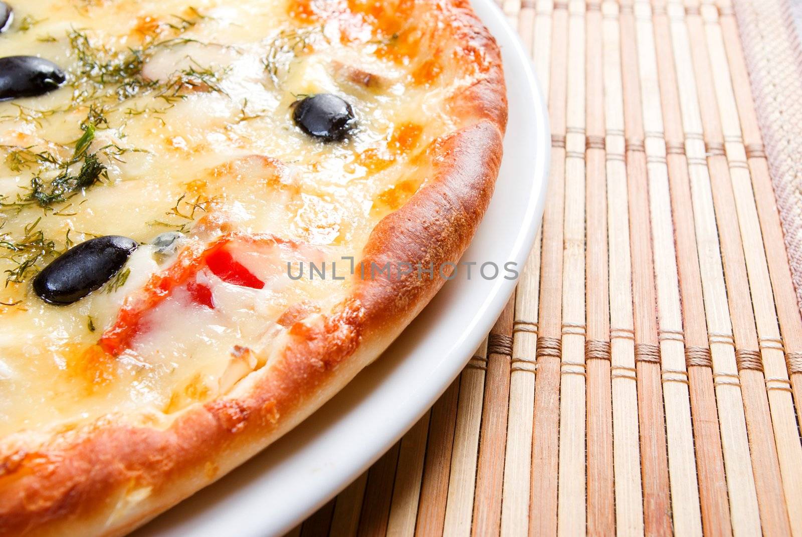 Supreme Pizza on plate.