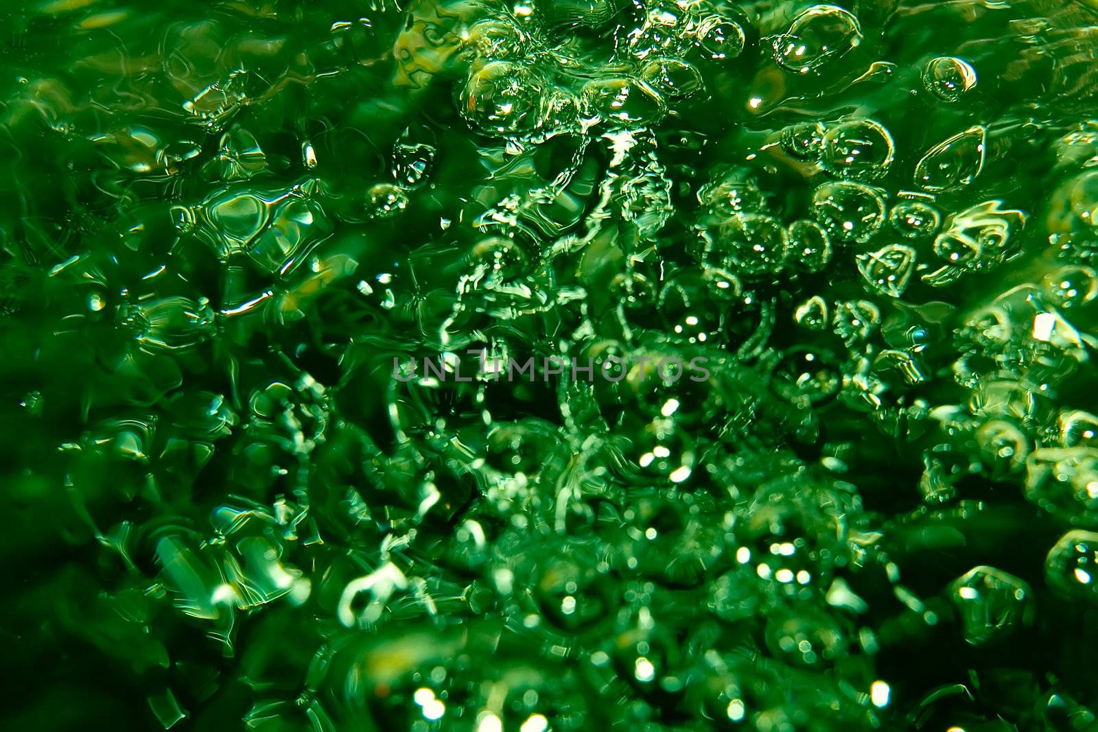 Abstract photo of green toned pouring water
