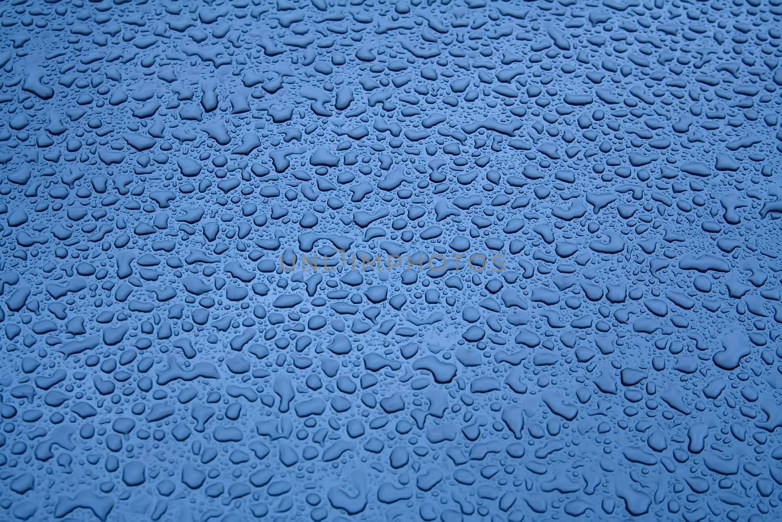 Water Droplets on a Steel Surface. In Blue by Sergius