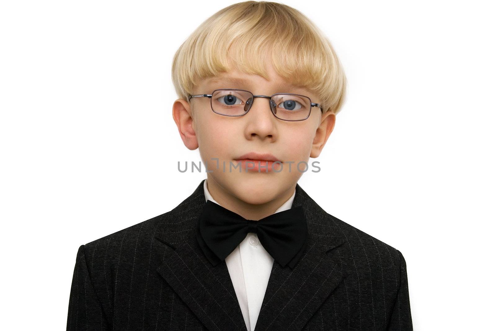 Boy in black suit on a white background