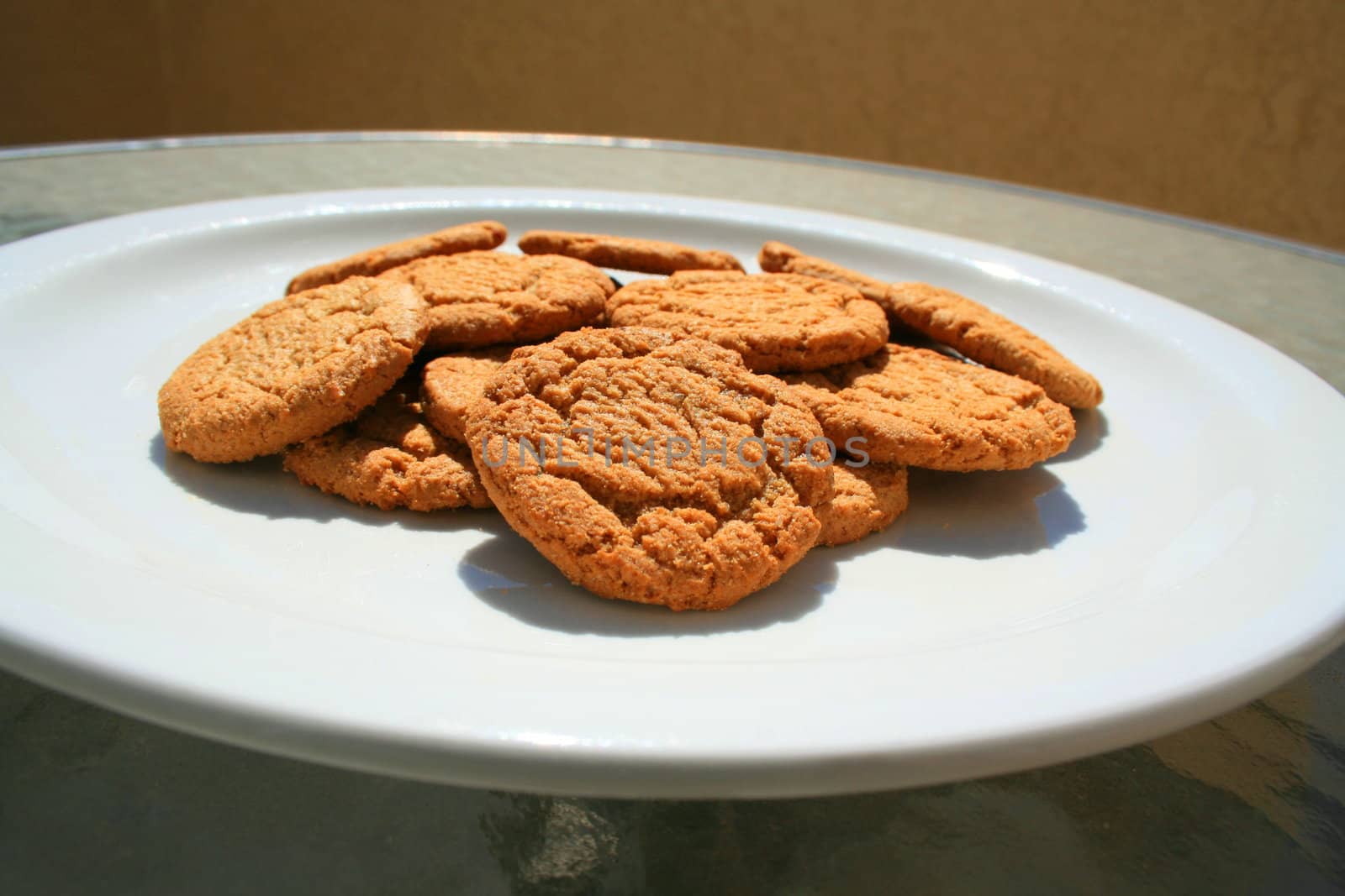 Close up of ginger snap cookies on a plate.
