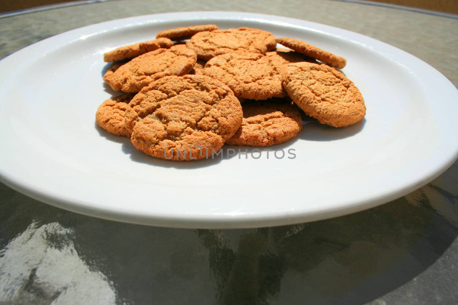 Close up of ginger snap cookies on a plate.
