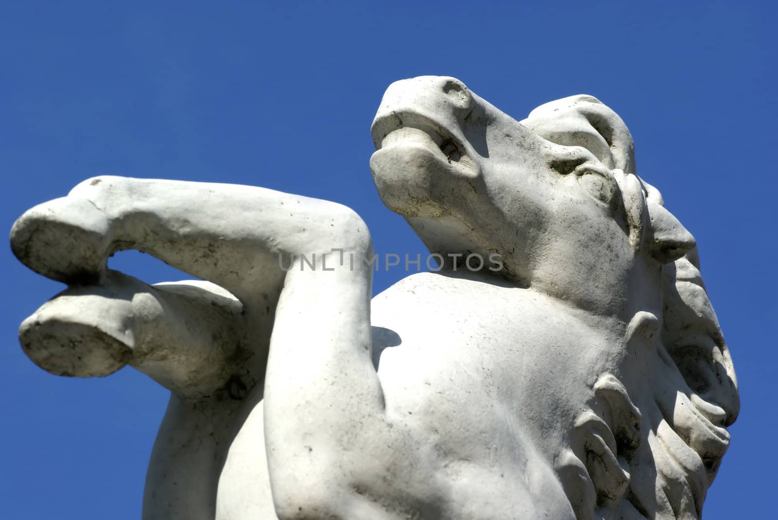 A horse statue against a blue sky.