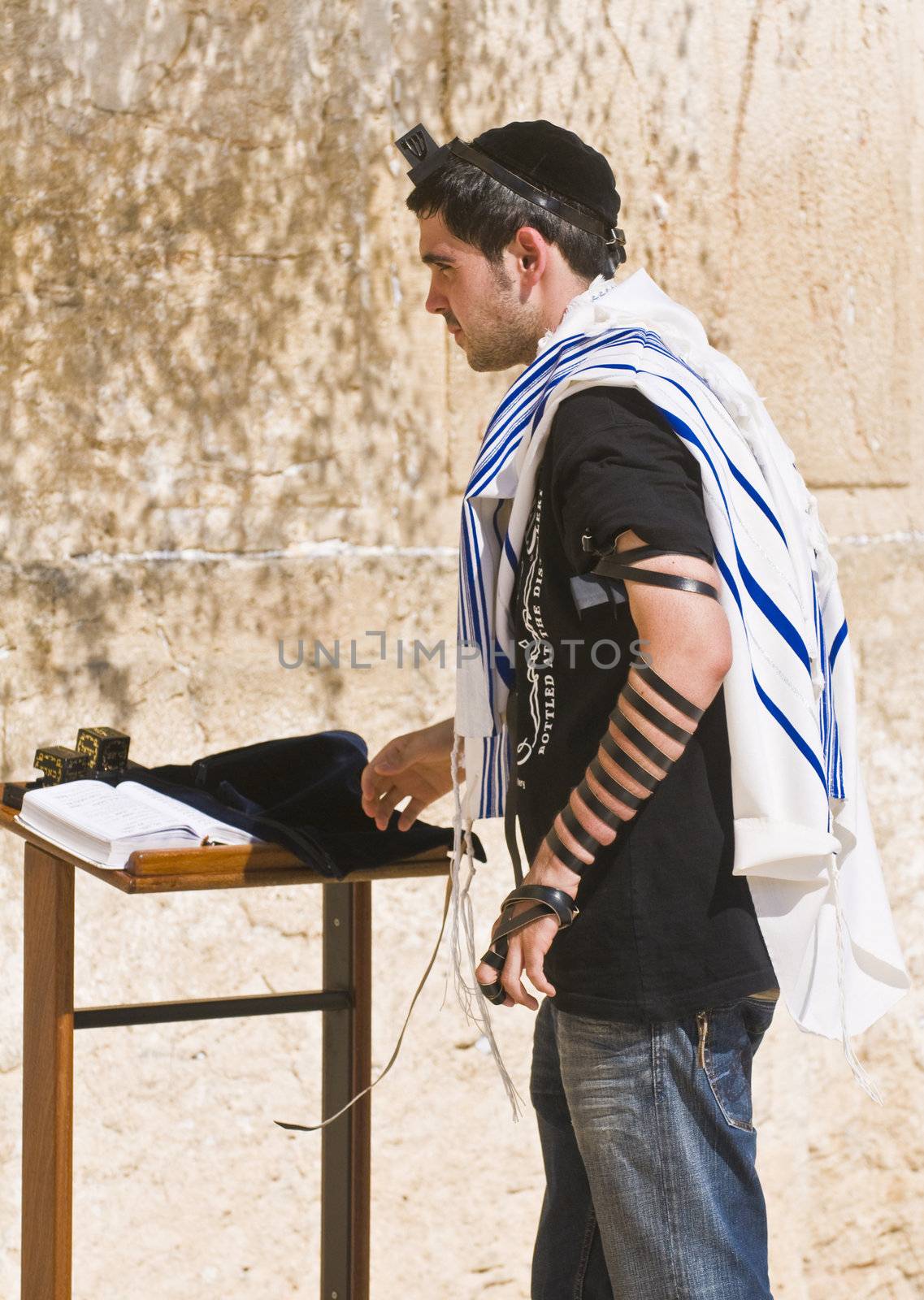 September 2008 Jerusalem Israel - A jew lay tefillin in The western wall an Important Jewish religious site located in the Old City of Jerusalem 