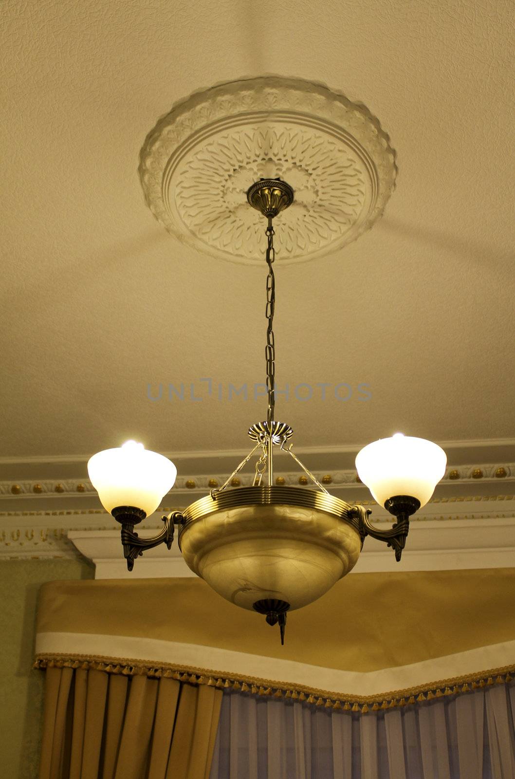 Bronze chandelier view from below with moldings by pt-home