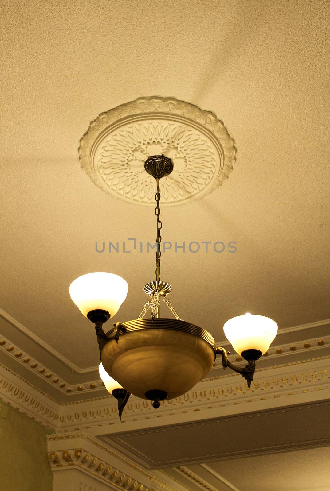 Bronze chandelier view from below with moldings by pt-home