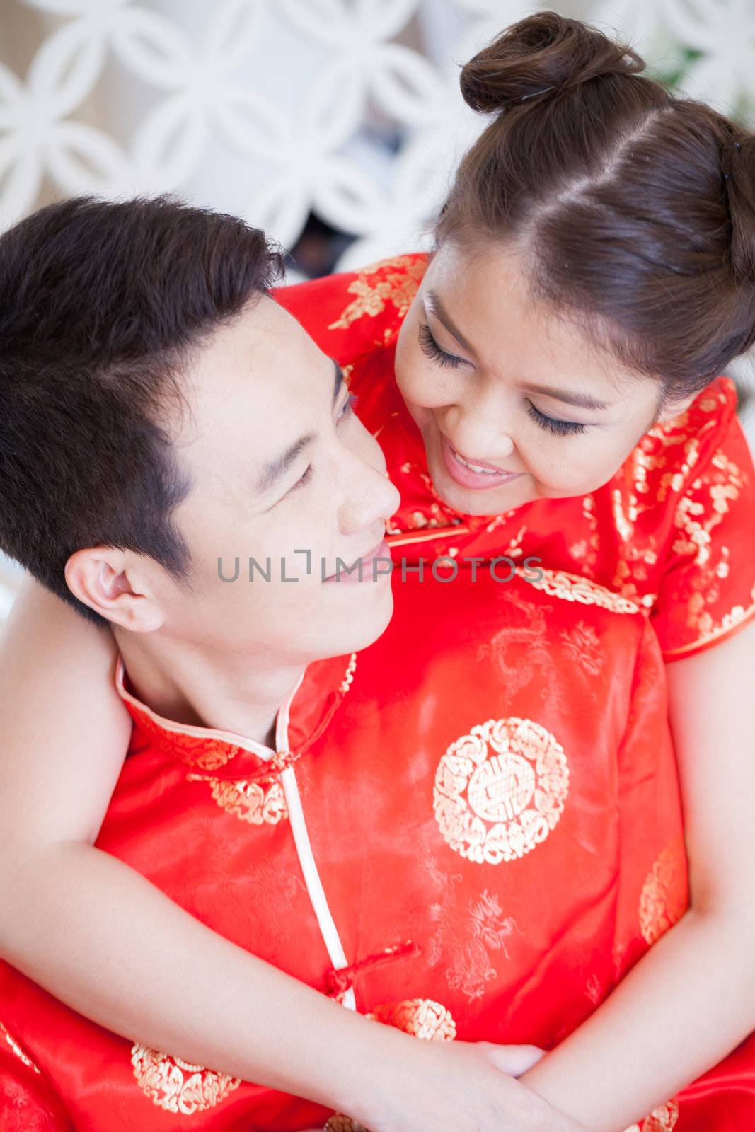 Happy Young Couples in love kissing with chinese dress