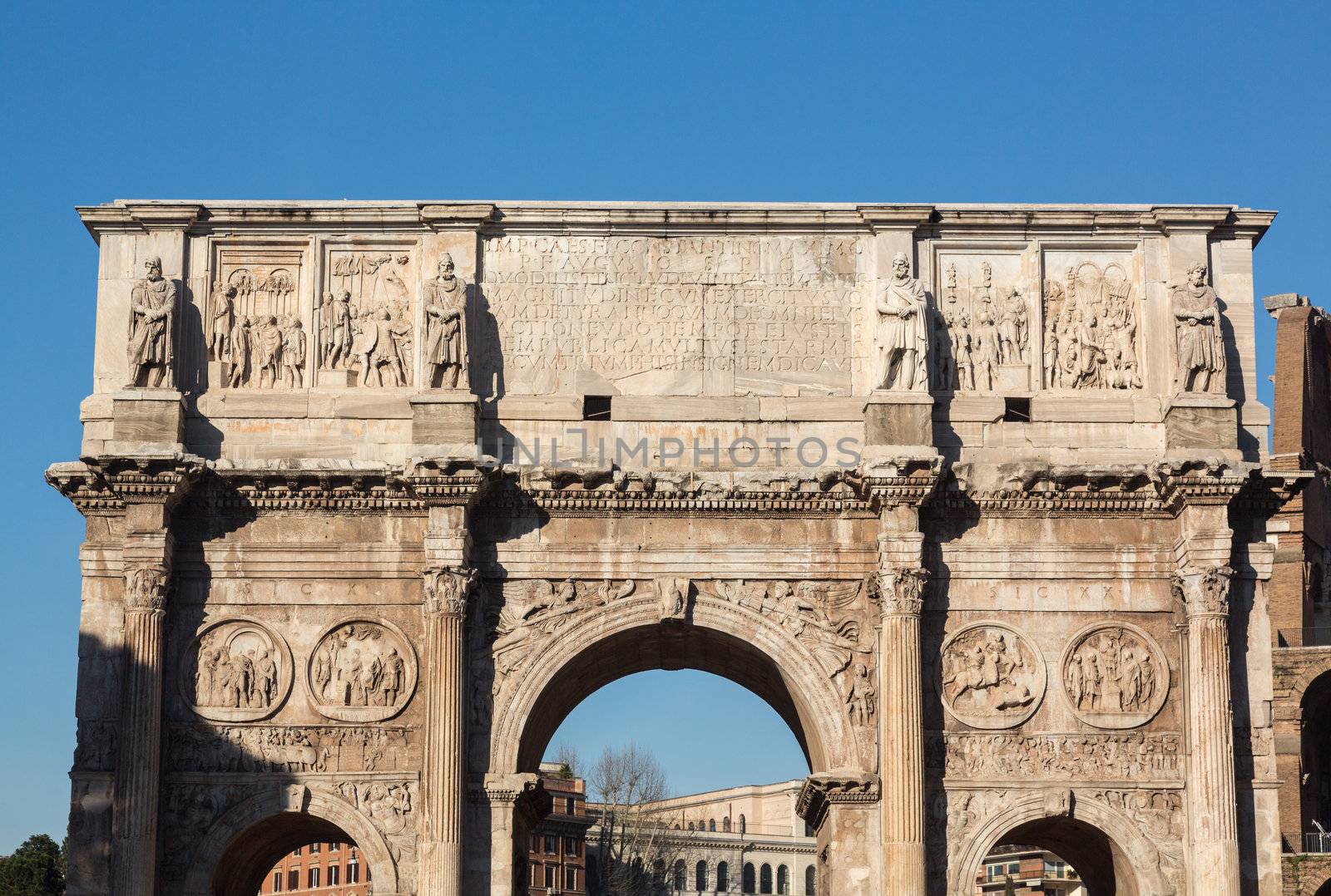 Detail of arch of Constantine and Colosseum in Ancient Rome