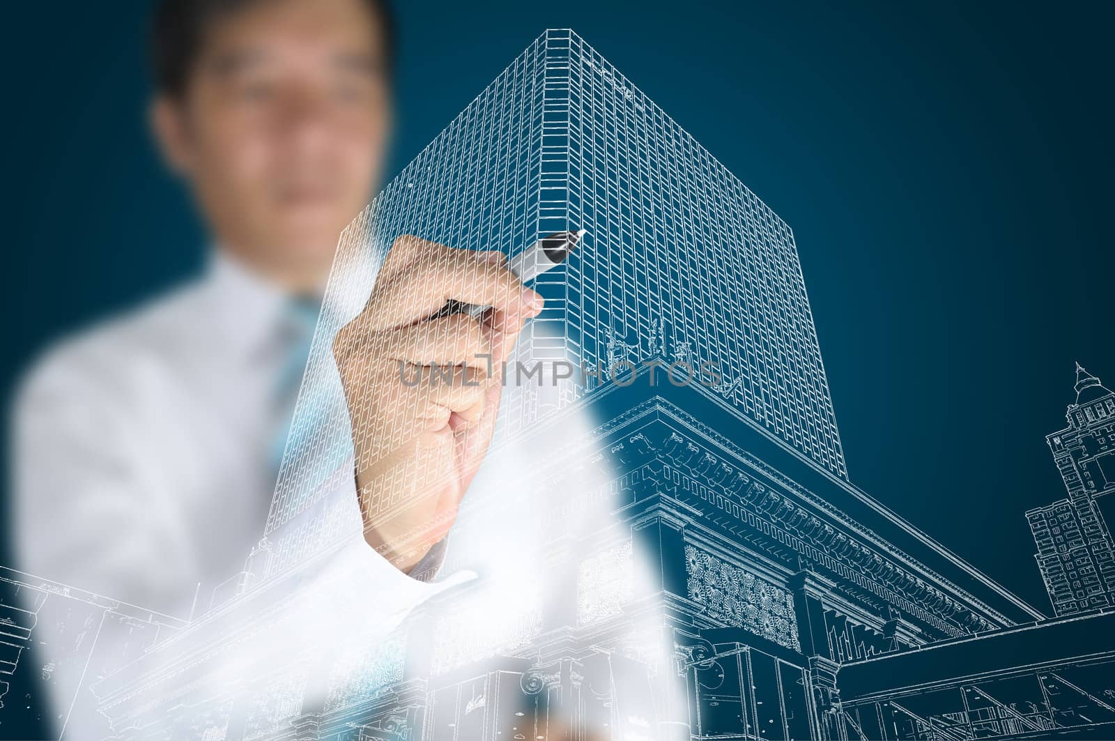 Businessman draw modern building and cityscape