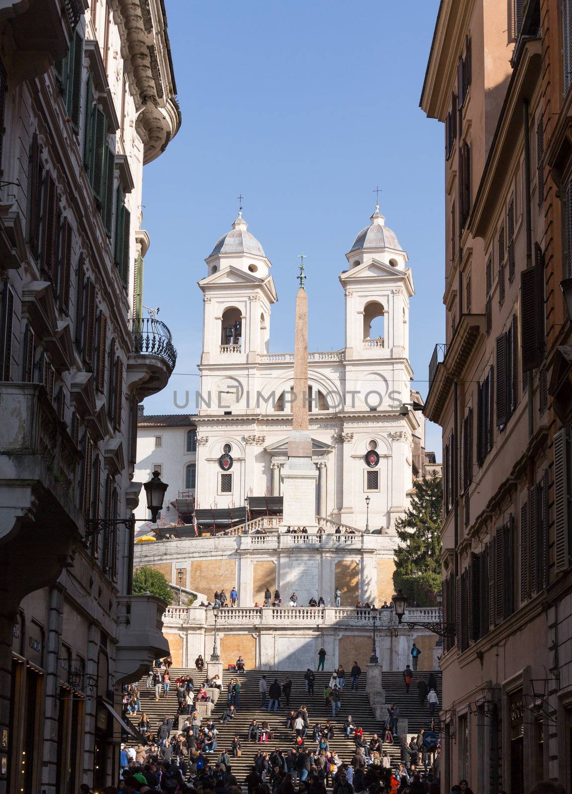 ROME, ITALY - JANUARY 27: Tourists sitting on Spanish Steps in Rome on January 27, 2013. The 138 steps were renovated in 1995