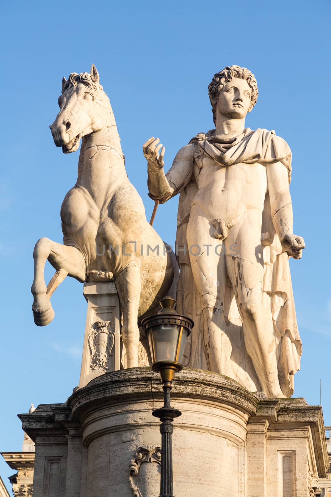 Facade of Comune di Roma or town hall in Rome Italy with statue