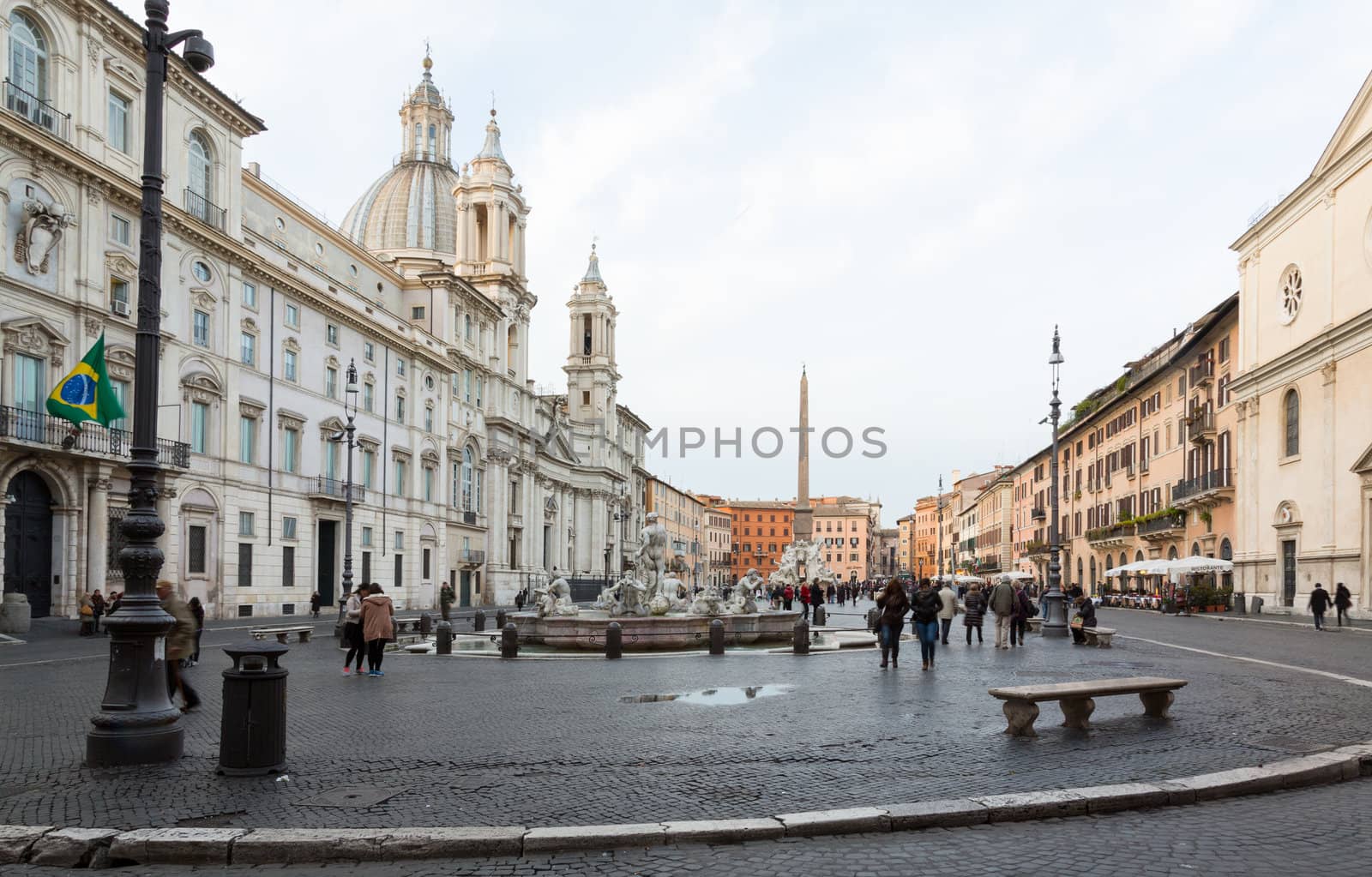 ROME, ITALY - JANUARY 29: Tourists and locals stroll in Piazza Navona in Rome on January 29, 2013. The famous statue was built in 1651