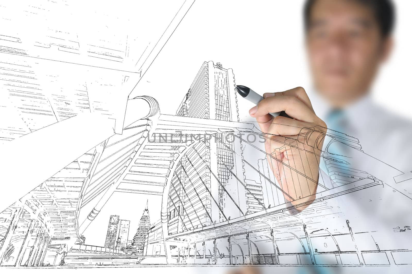 Hand of business man draw building and cityscape by thampapon