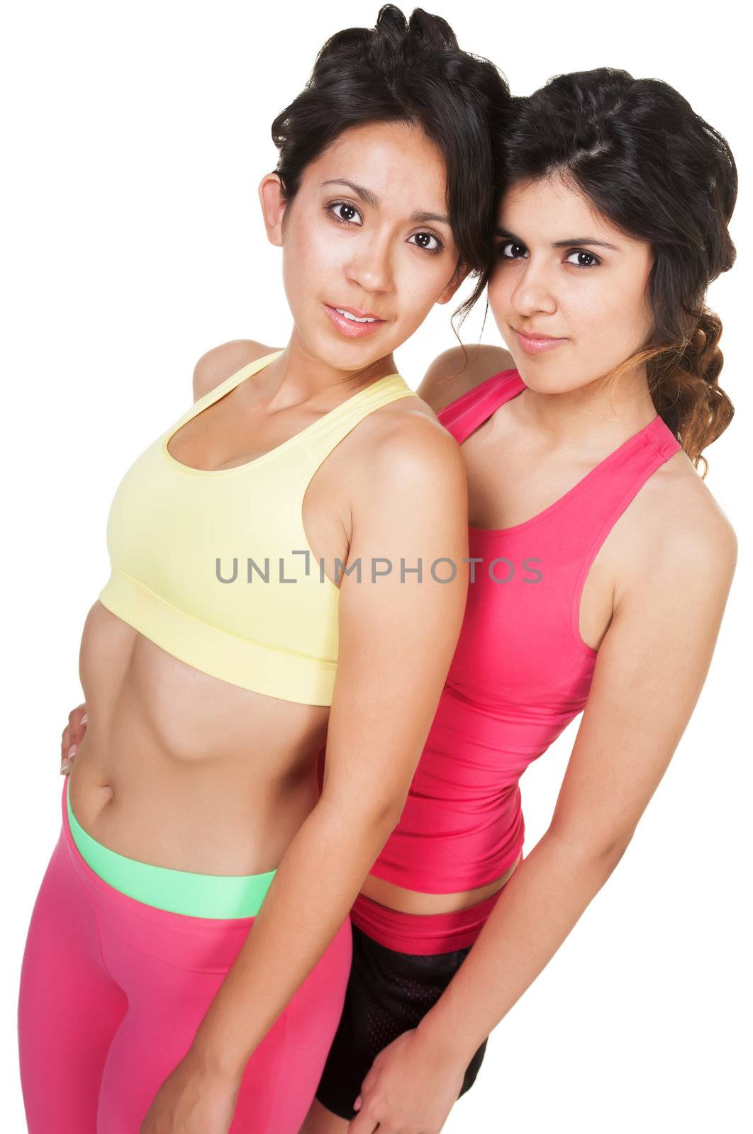 Two pretty young athletic women on isolated background
