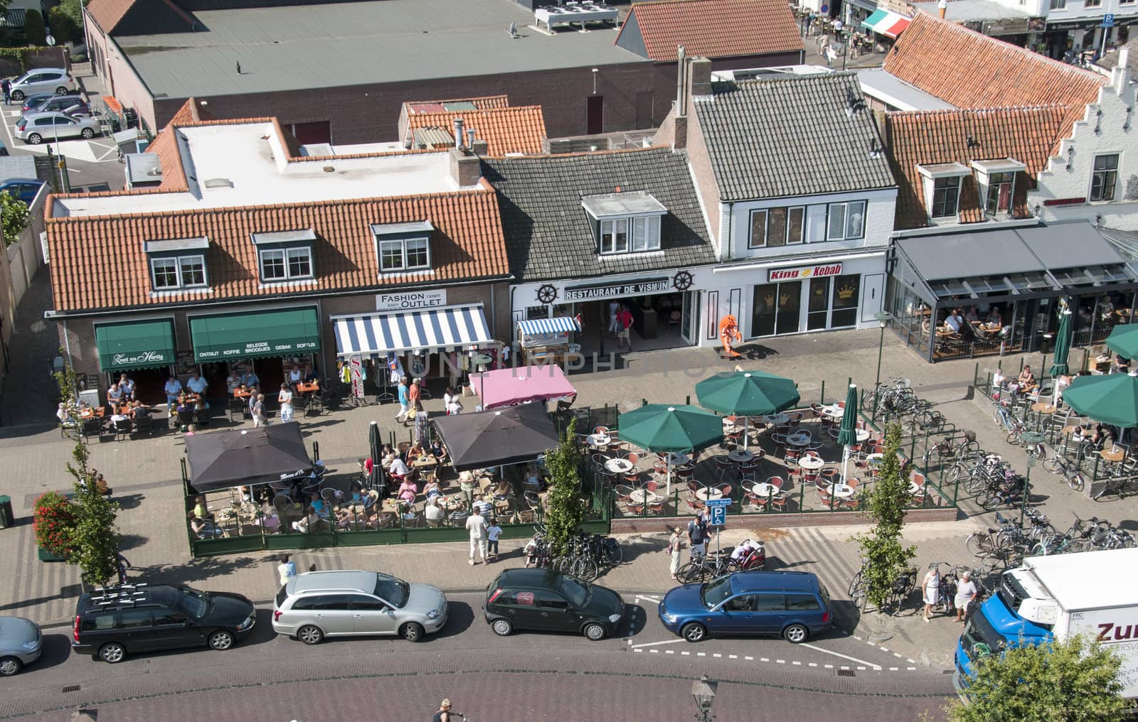 People having fun on  a terrace in Renesse , Holland, the first day this summer with sun and good temperature