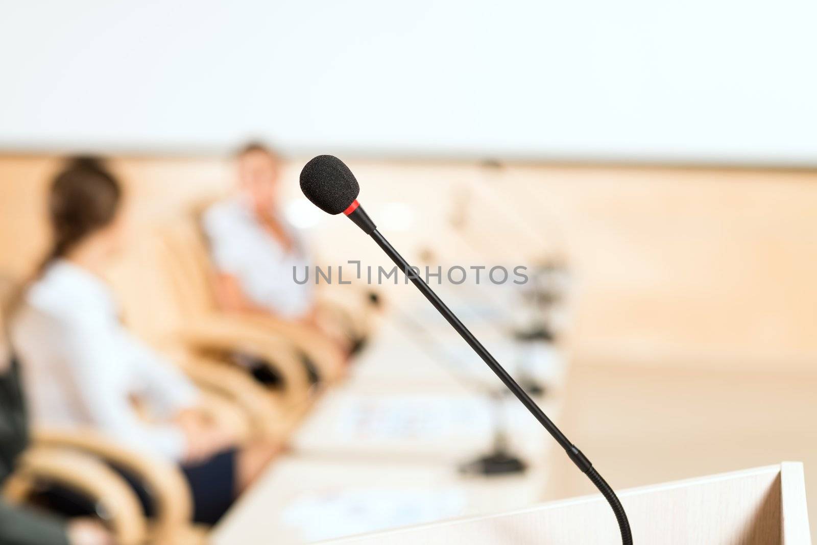 close-up microphone, on the background of business communication at the conference