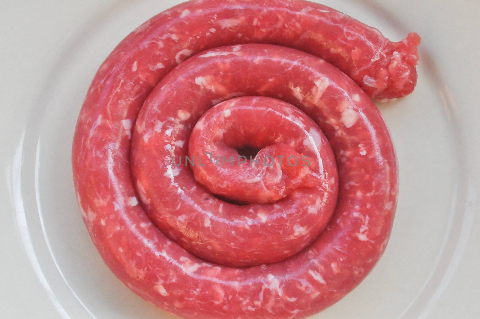 Detail of beef sausage in a dish