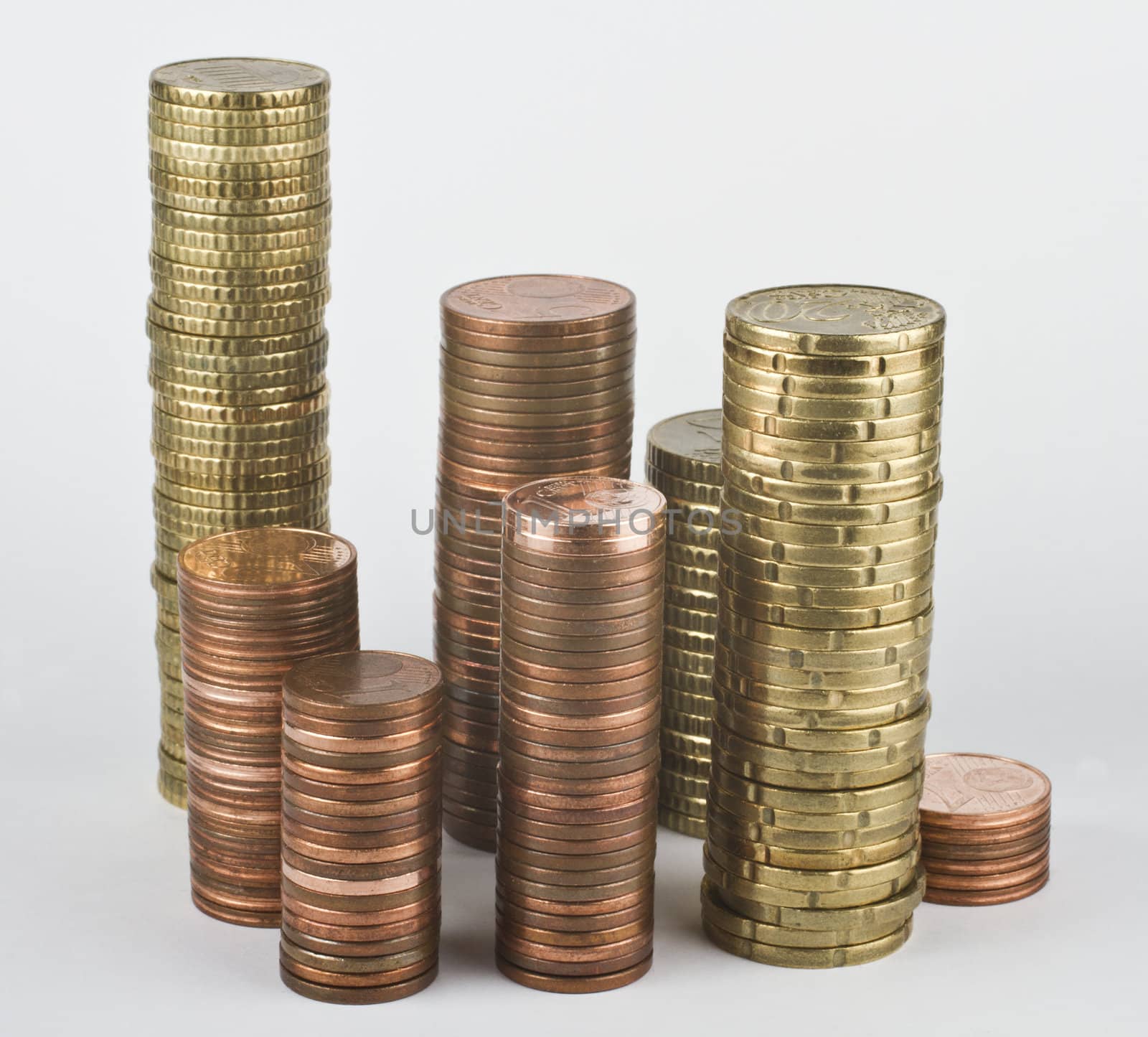 stacks of euro coins in grey background