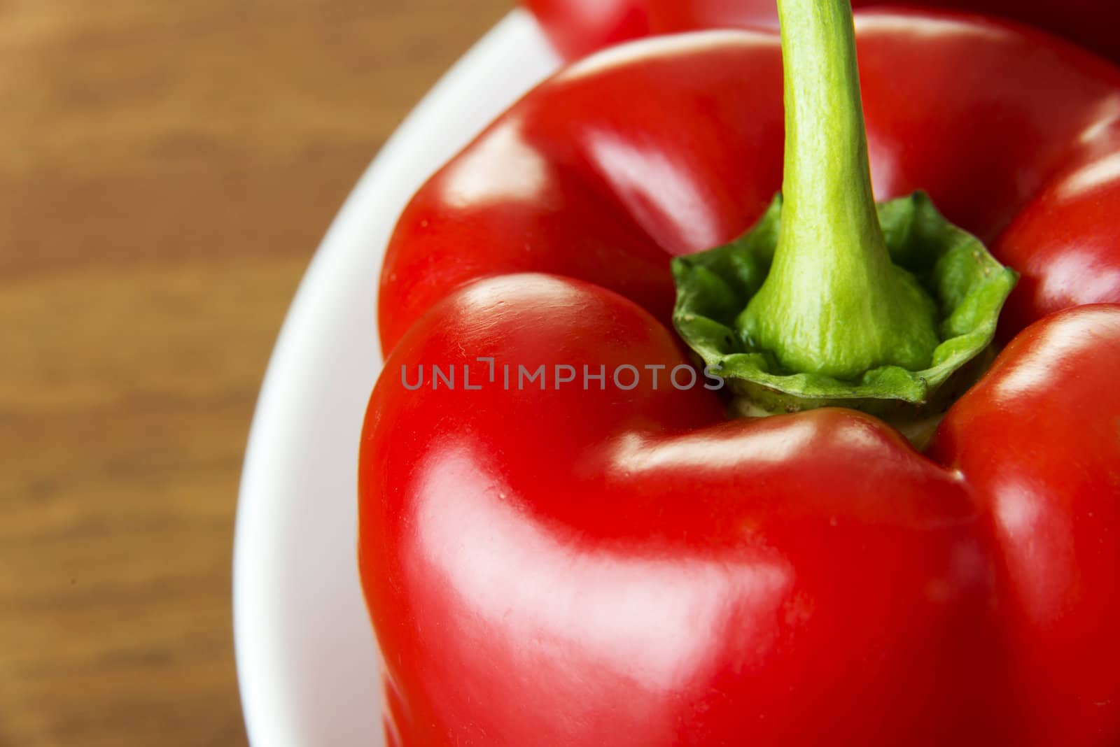 Red sweet pepper on table