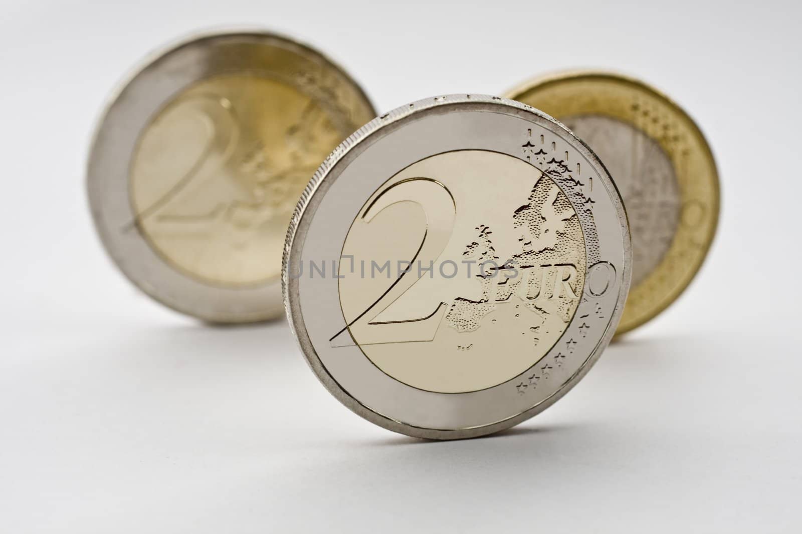 Three Euro Coins with focus on front coin